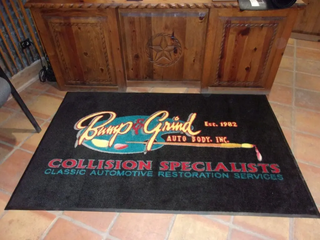 Bump and Grind Auto Body Logo Rug 2 scaled