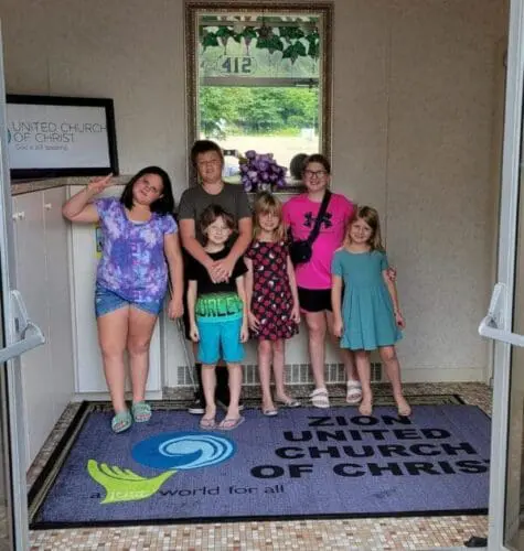 Branded custom door mat welcoming customers at commercial entrance