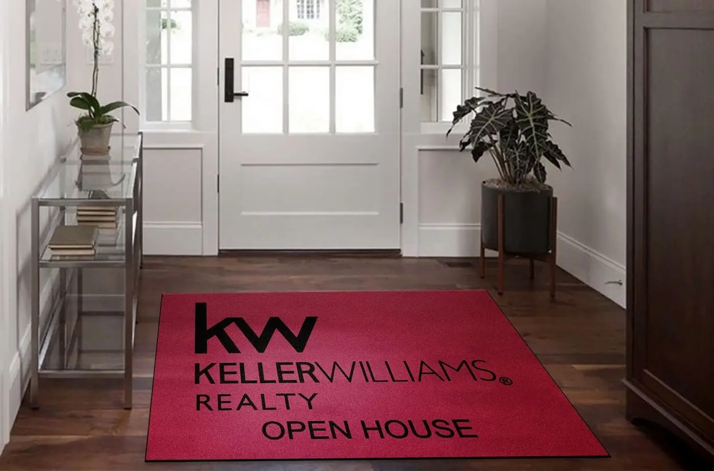 Personalized logo mat at small business storefront entrance with owner brand and colors
