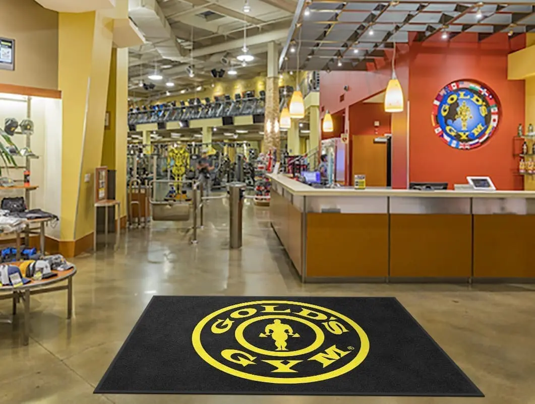 Design rendering of a custom Gold's Gym logo entrance mat at a fitness center entrance