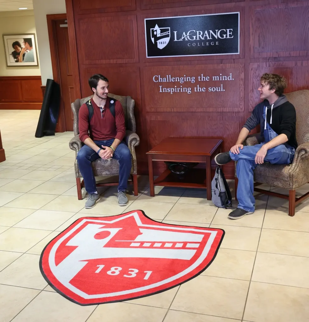 Custom-shape DigiPrint HD mat featuring the LaGrange College shield in a campus building lobby, paired with wall branding