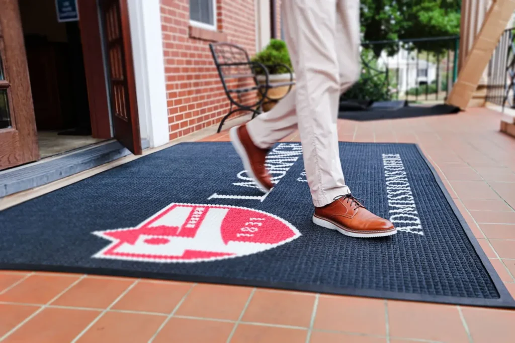 Close-up of a custom-printed WaterHog Impressions HD entrance mat showing the LaGrange College shield