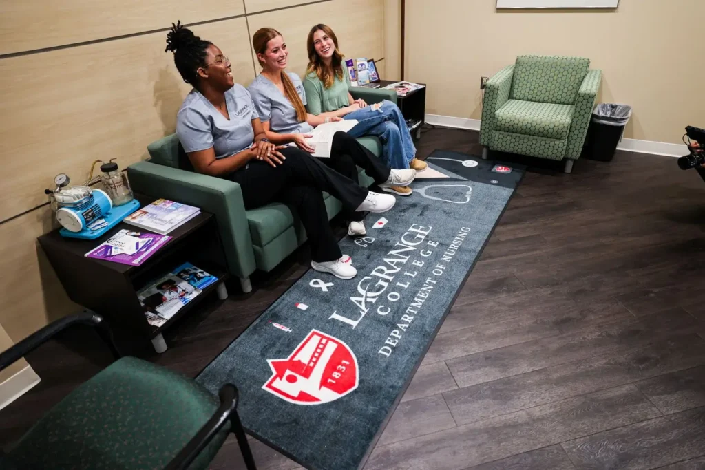 Custom DigiPrint HD area rug featuring the LaGrange College shield and Department of Nursing iconography in a student seating area