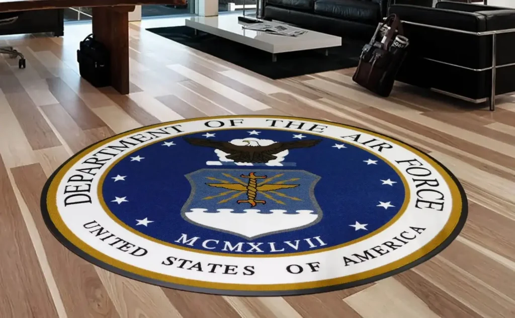 Close-up of a Piazza hand-inlaid custom logo mat by Rug Rats showing solid-color carpet fibers inlaid into the mat surface