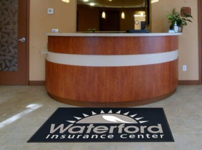 Waterford insurance logo rug